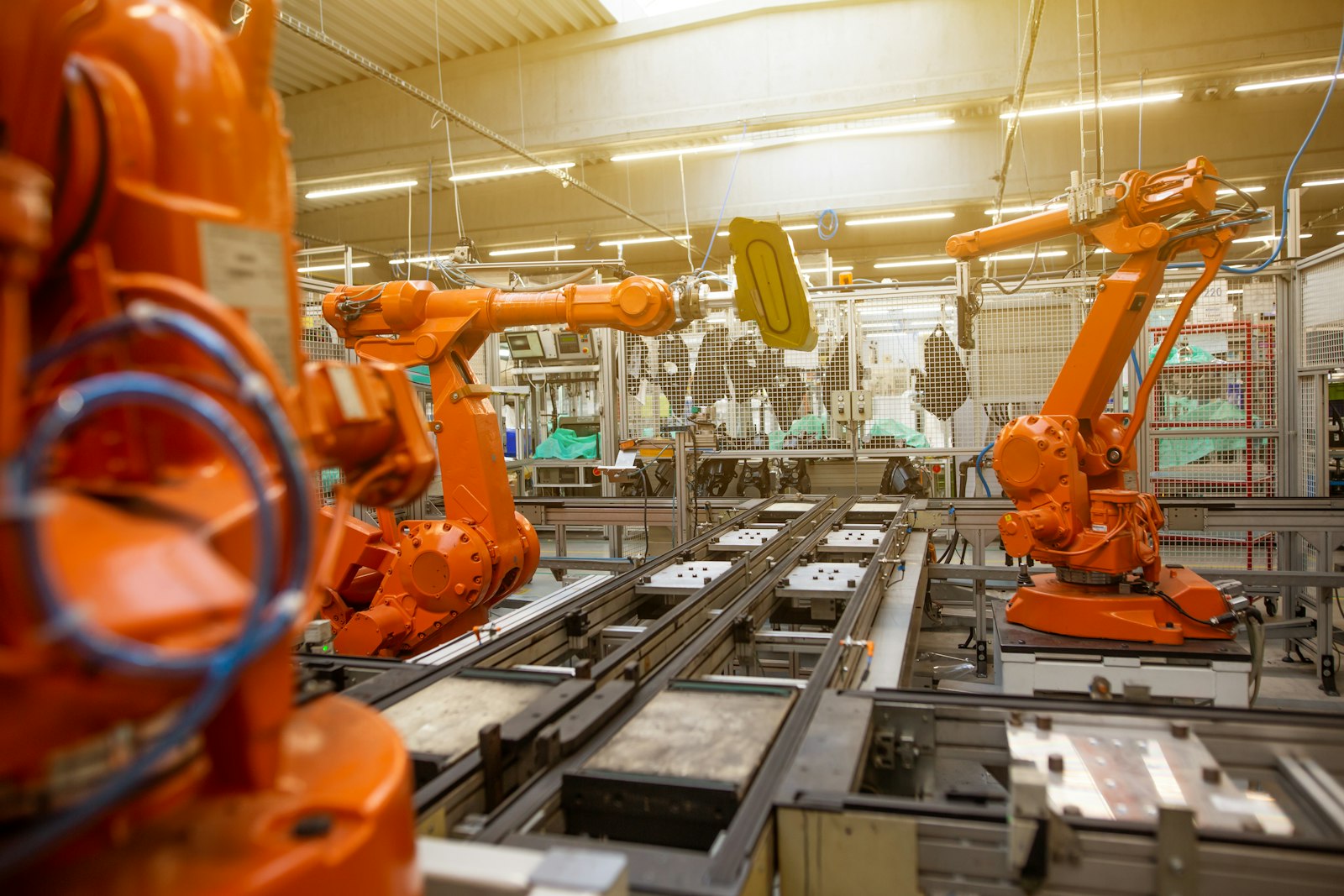 Industrial robot arms working on an automated production line
